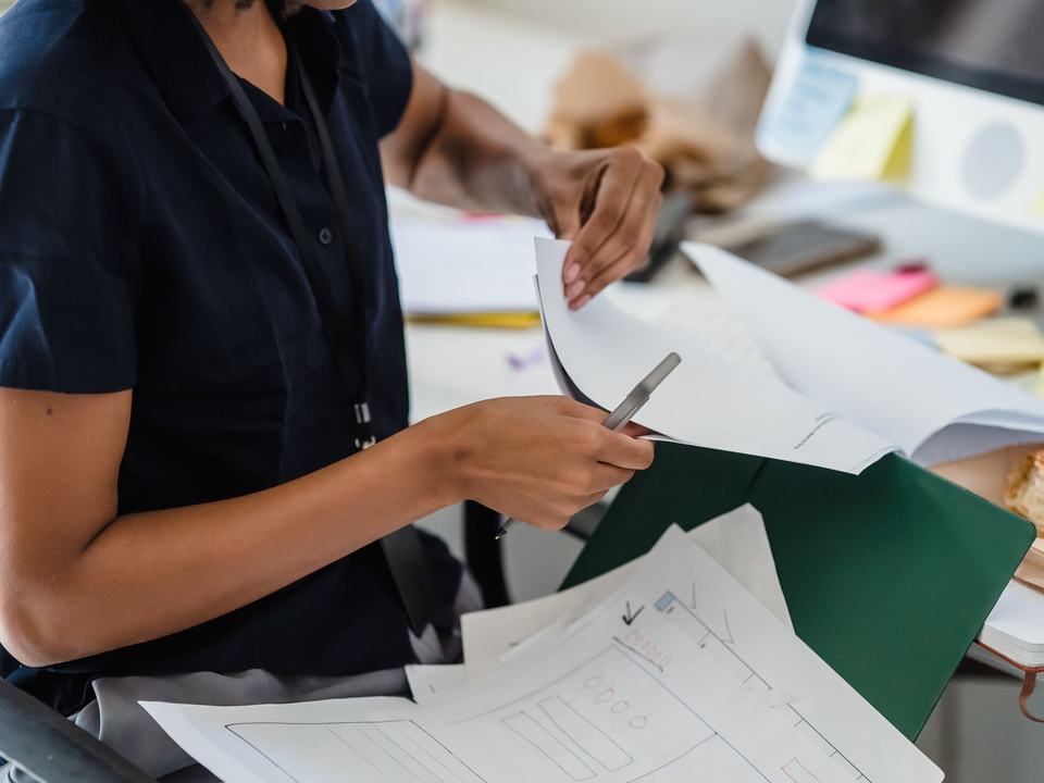 Two people reviewing disposal documents at a table