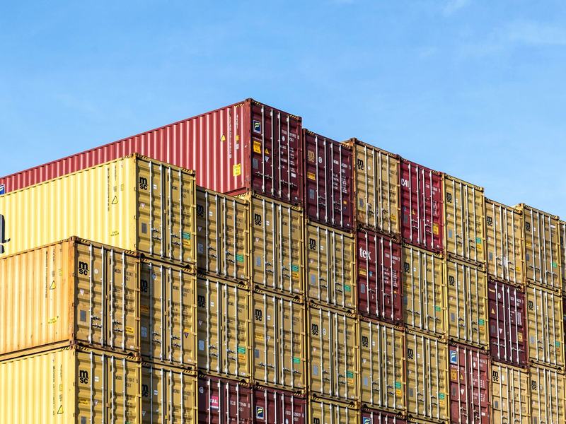 Shipping containers stacked at a depot