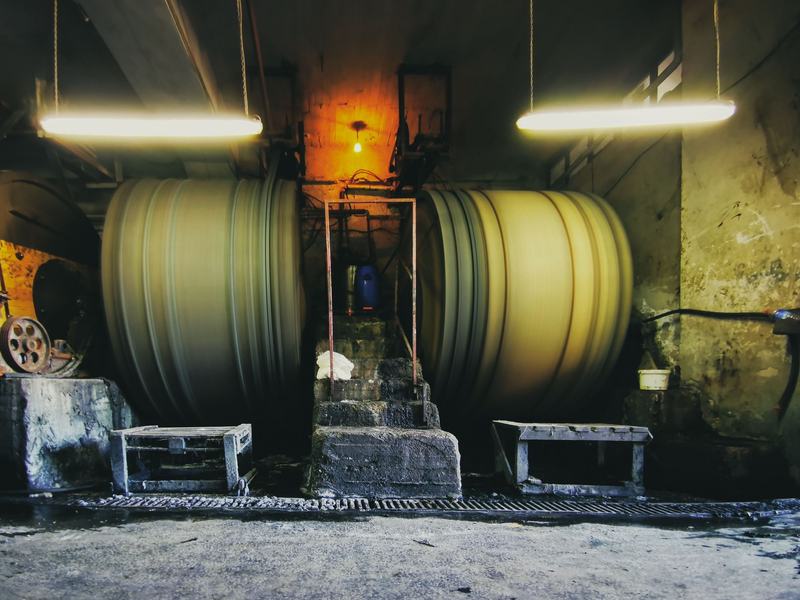 Large rotating process drums running inside a production plant