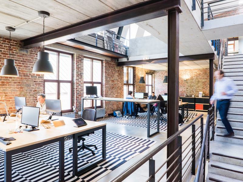 Open plan office desks and task seating cleared for removal