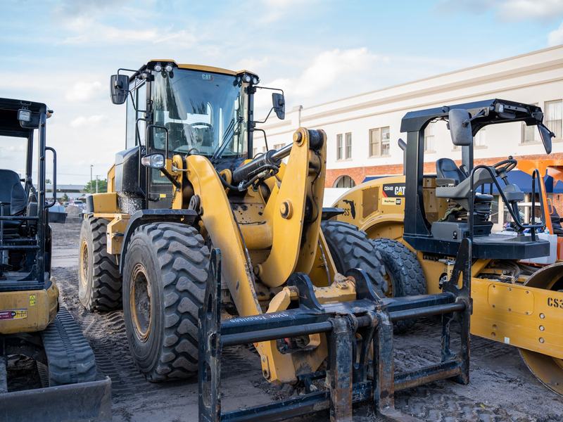 A row of plant machinery lined up in a yard