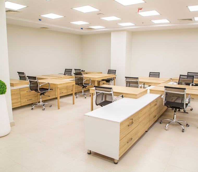 Open plan office with desks and seating