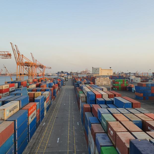 Shipping containers stacked at a depot