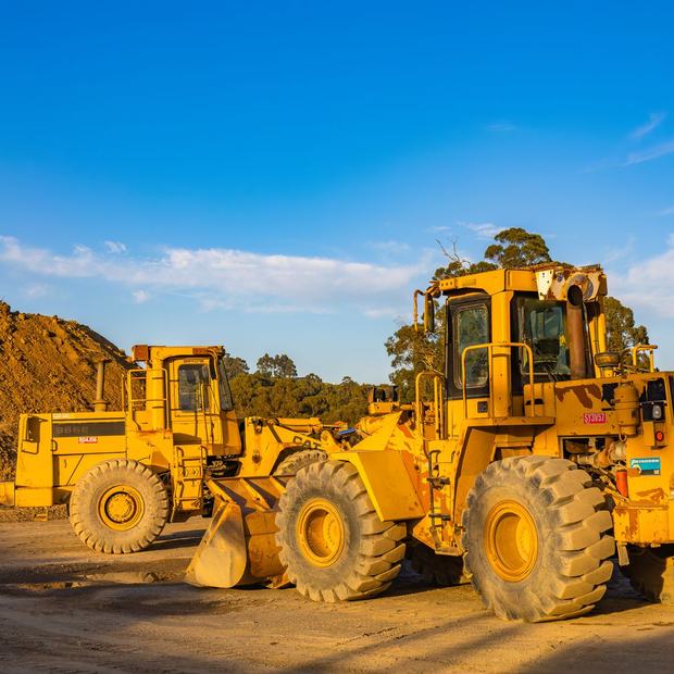 Heavy plant machinery standing on a site